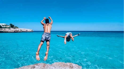 a surfer on the beach in the Caribbean